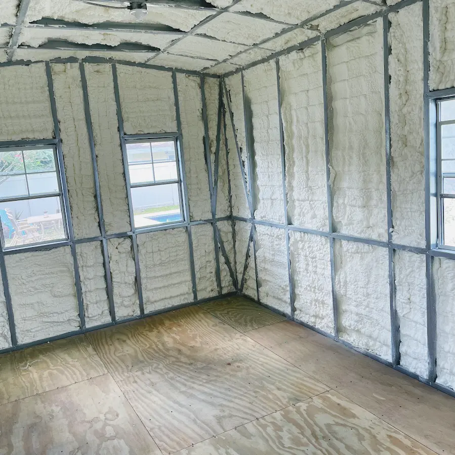 Closed-cell spray foam insulation applied to wall cavities in a residential project in Waterbury