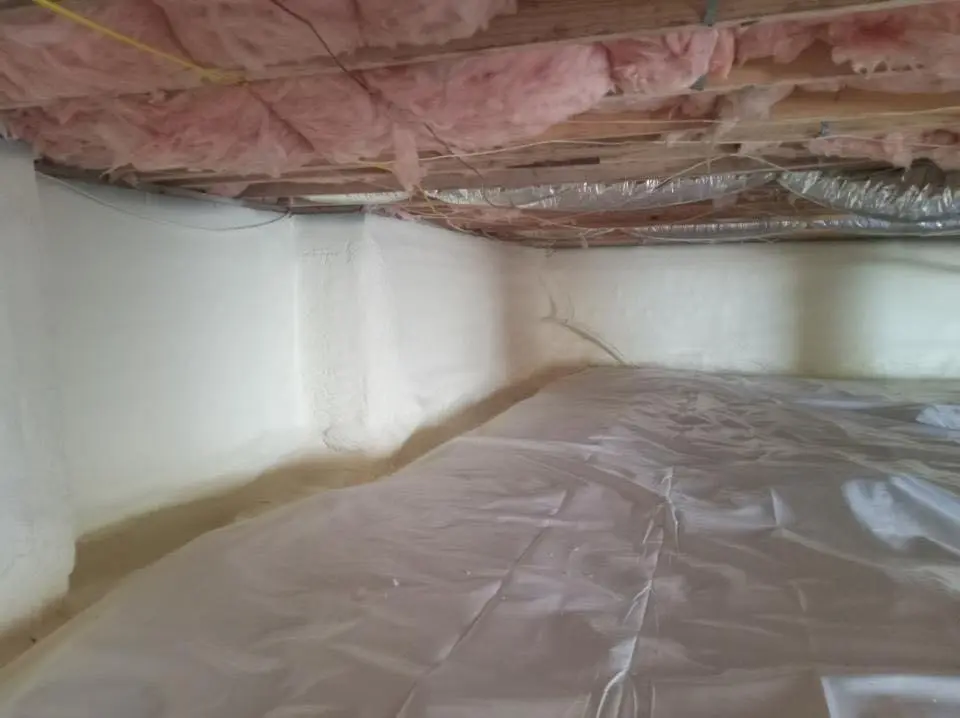Crawl space encapsulation with closed-cell spray foam for Roof Waterproofing in Waterbury